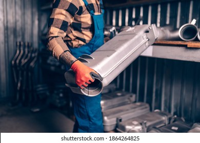 Handsome Adult Man Working In Car And Truck Spare Parts Warehouse. 