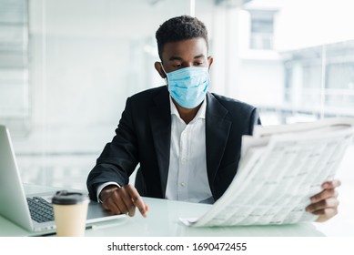 Handsome African American Businessman Wear In Medical Mask With Newspaper In The Morning Near Business Centre Office