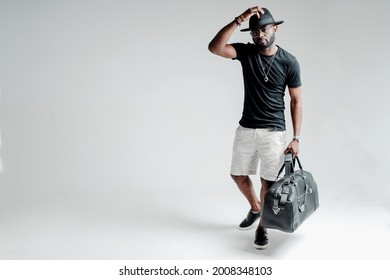 Handsome African American Man In A Hat Holding A Gym Bag In His Hands Getting Ready For A Workout