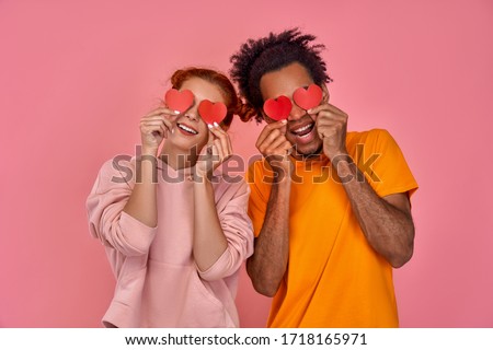 Similar – Image, Stock Photo Woman covering eye with orange slice and gesturing silence