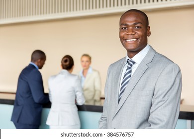 Handsome African American Manager Standing At Hotel Reception