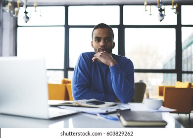 Handsome Afro American Hipster Guy Student Of Journalism Faculty Concentrated On Creation Book Review For Popular Teenage Online Issue Waiting For Inspiration Sitting With Modern Gadgets In Cafe