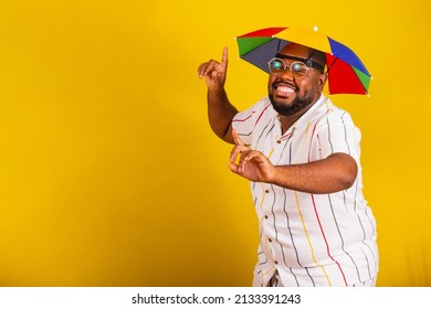 handsome afro brazilian man, dressed for carnival, typical brazilian party, carnival, revelry, partying. Chosen sign, finger raised, I, choose me, dancing, merry. partying. having fun. - Shutterstock ID 2133391243