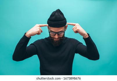 Handsome American Hipster Guy With Beard Wearing Casual Beanie And Black Longsleeve Shirt With Space For Your Logo Or Design. Mockup For Print