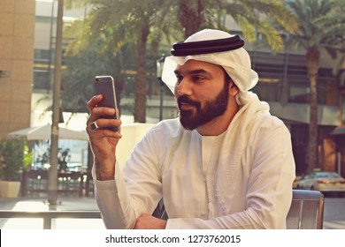 A Handsome Arab Business Man Using Mobile Technology ( Online Shopping )