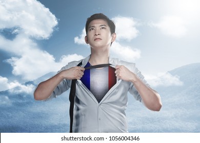 Handsome Asian Businessman Ripped His Shirt Off And Showing France Flag Color. Happy Bastille Day