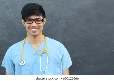 Handsome Asian Male Student Smiling on Gray with Copy Space