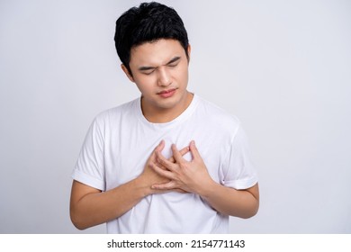 Handsome Of Asian Man Holding Hands On Chest Suffering From Heart Attack, Closeup.