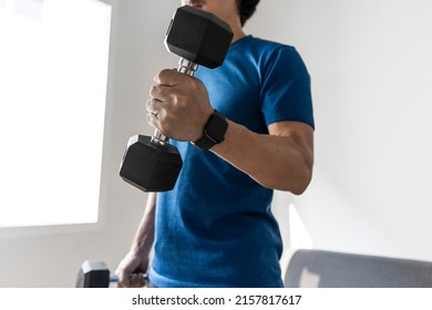 Handsome asian man lift dumbbell and exercising at home. - Powered by Shutterstock