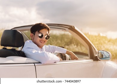 Handsome Asian Man  Sitting On Car With Mountain Background In Vintage Tone. Luxury Life.travel