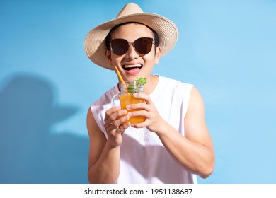 Handsome asian man wearing sunglasses holding cocktail in hand 
 - Powered by Shutterstock