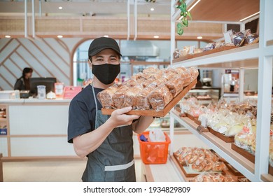 Handsome Asian Smiling Worker At The Bakery Shop