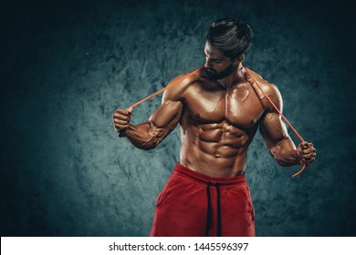 Handsome Athletic Man Posing With Jump , Skipping Rope