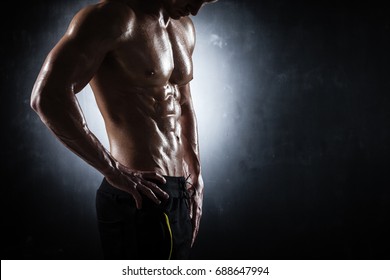 Handsome Athletic Man Posing On Black Background