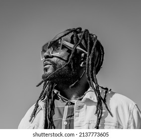 Handsome attractive young african american man with dreadlocks outdoor. White and Black Photo. Street photo. White Rock BC, Canada-March 3,2022