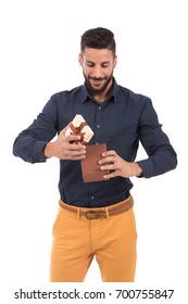 Handsome Beard Young Man Smiling And Opening A Brown Gift Box, Guy Wearing Dark Blue Shirt, Isolated On White Background