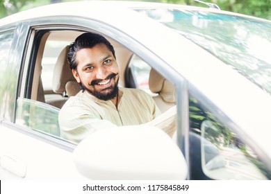 Handsome Bearded Indian Man In Kurta Driving A Car