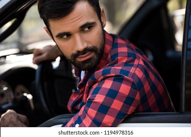 Handsome Bearded Man Driving Pickup Truck  