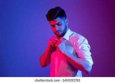 Handsome Bearded Man In Neon Light Posing