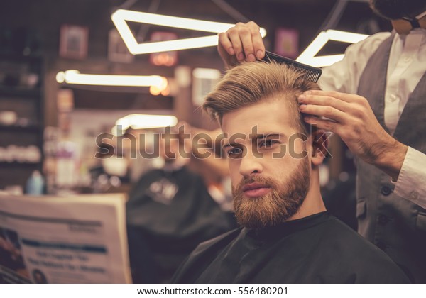 Handsome Bearded Man Reading Newspaper While Stock Photo Edit Now