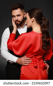 Handsome Bearded Man With Sexy Lady On Dark Background