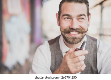 Handsome Big Moustache Hipster Man Smoking Pipe In The City