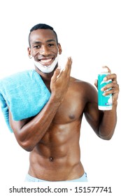 A Handsome Black Man, Holding A Can Of Shaving Cream, With Shaving Cream Applied To His Face.