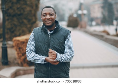 Handsome Black Man Walking In Autumn City