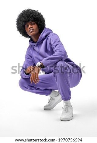 Handsome black man wear tracksuit isolated on white background