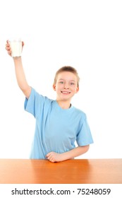 Handsome Blond Boy Raising Hand With Glass Of Milk