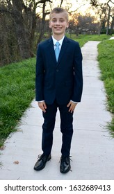 Handsome boy dressed in a sharp suit with tie