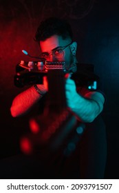 Handsome Boy Pointing At Camera With An Electric Guitar, Blue And Red Gel Lights. Boy With Rock And Roll Attitude