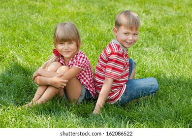 Boy Girl Sitting Together On Grass Stock Photo 111167933 | Shutterstock