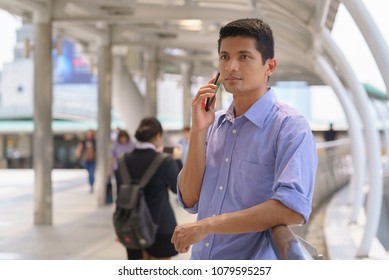 Handsome boy using smartphone.