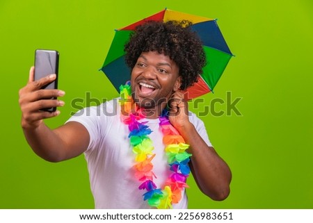 handsome brazilian man, dressed for carnival, typical brazilian party, carnival, revelry, party. chatting on cell phone, video call, selfie, self photo, video conference,