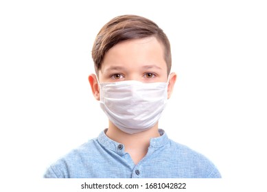 Handsome brunette boy in medical mouth mask over white background - Powered by Shutterstock