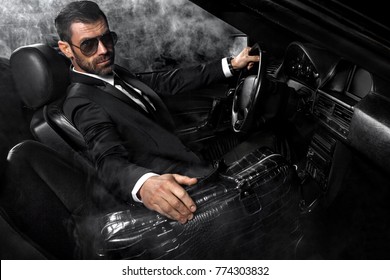 Handsome Brutal Man In The Car. Luxury. Night Life.