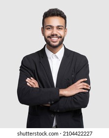 Handsome Business Man With Crossed Arms Studio Shot, Isolated On Grey Background. Candid Portrait, People Concept