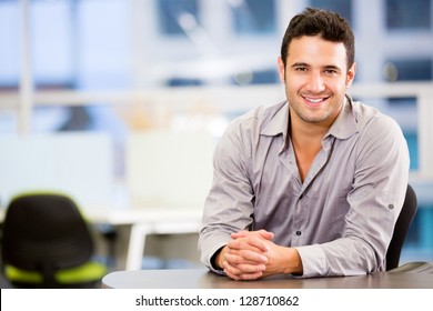 Handsome Business Man Smiling At The Office