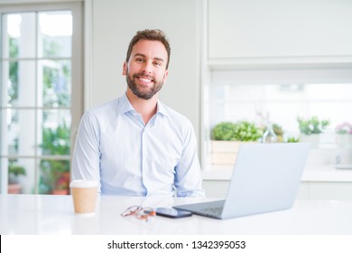 Handsome business man working using computer laptop and smiling - Shutterstock ID 1342395053