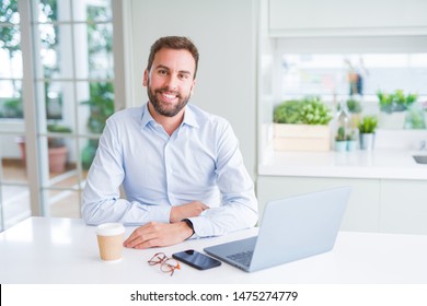 Handsome business man working using computer laptop and smiling - Shutterstock ID 1475274779