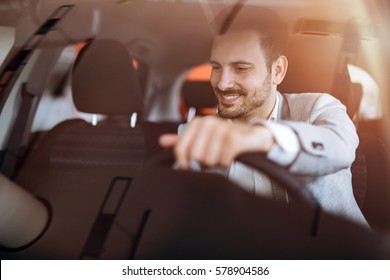 Handsome Businessman Driving Car Before Buying