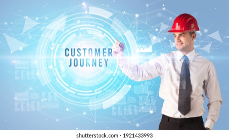 Handsome Businessman With Helmet Drawing CUSTOMER JOURNEY Inscription, Contruction Business Concept