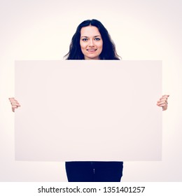 Handsome Businessman Holding A Large Poster For Advertising Signs