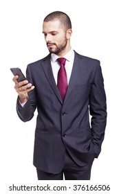 Handsome Businessman Reading A Message On His Smartphone, Isolated On White