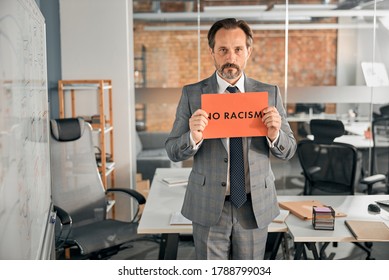 Handsome Businessman In Stylish Suit Supporting Movement Against Racial Discrimination