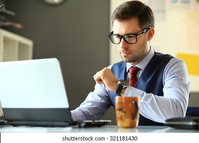 Handsome Businessman Working With Laptop In Office