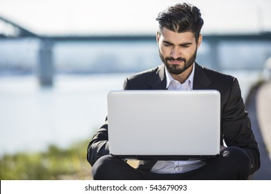 Handsome Bussines Man Using Laptop Outdoor