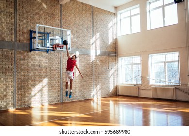 Handsome caucasian basketball player scoring a point. - Powered by Shutterstock