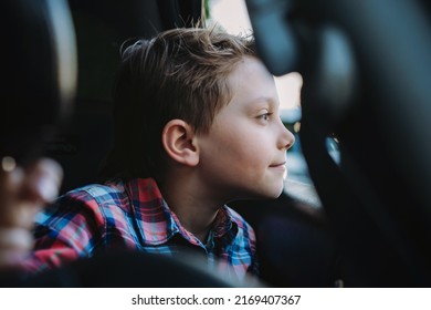 Handsome caucasian boy enjoy travelling by car sitting in child seat Recreation concept. Image with selective focus - Shutterstock ID 2169407367